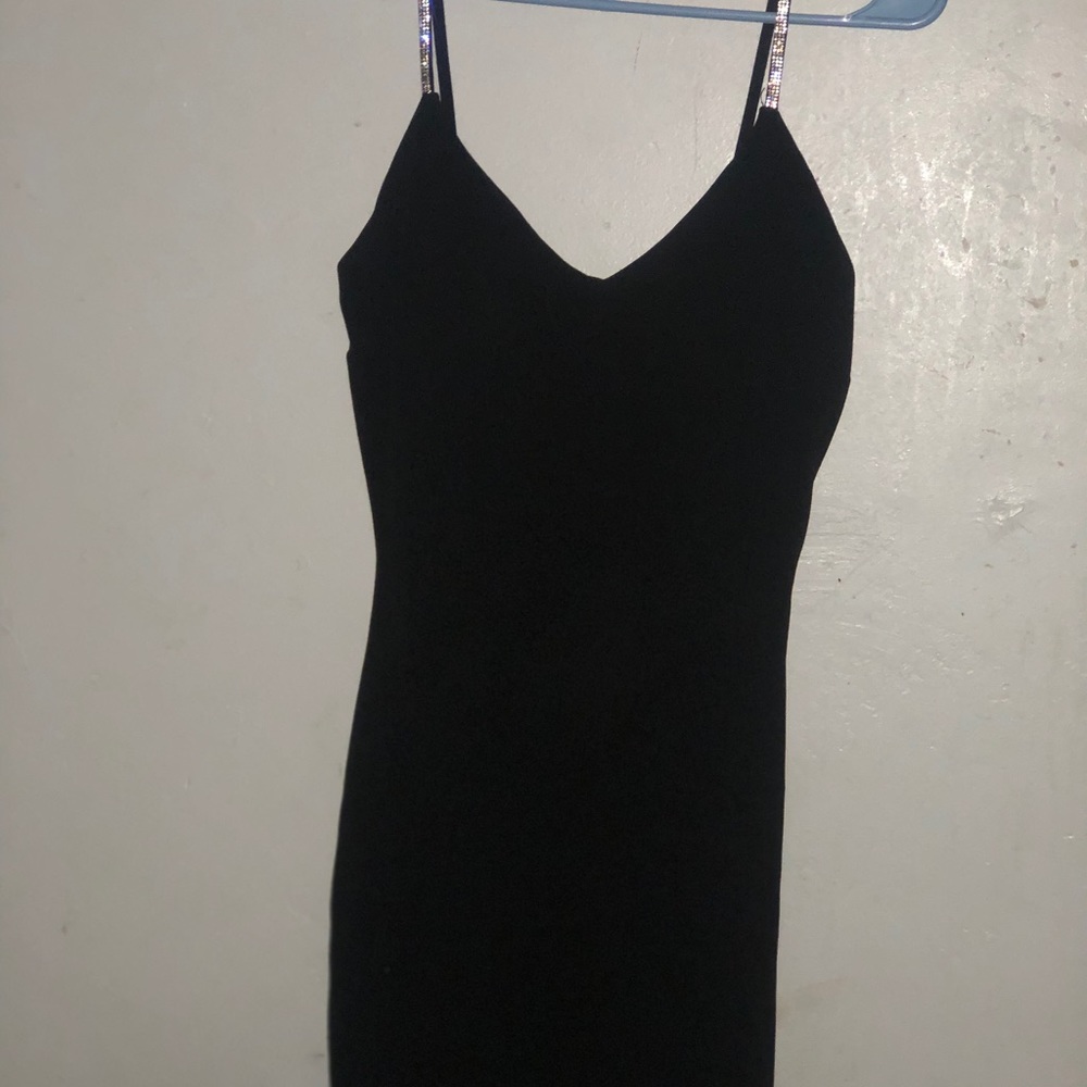 a bodycon slip black dress with bedazzled straps